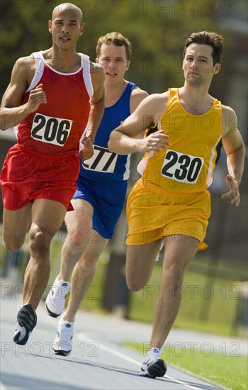 Runners racing on track.