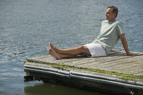 Man sitting on dock.