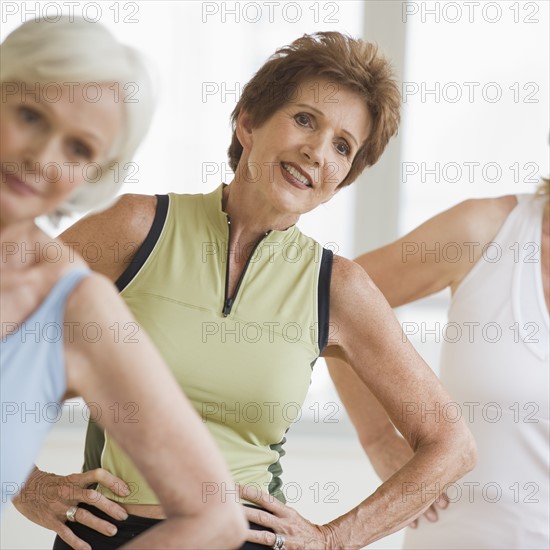 Senior women doing yoga.