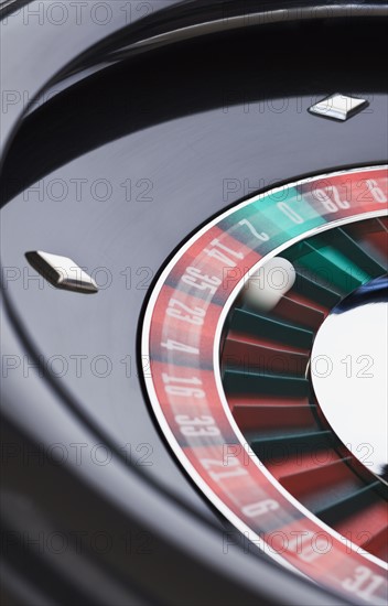 Close up of spinning roulette table.