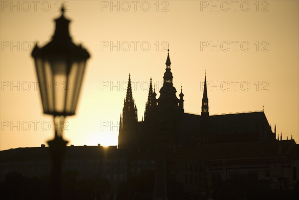 Sunset over silhouetted cathedral.