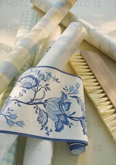 Assorted wallpaper and brush.