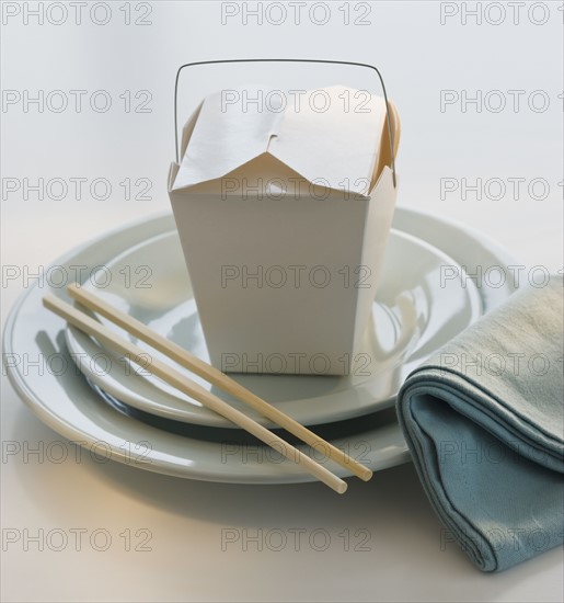 Takeout food and placesetting.