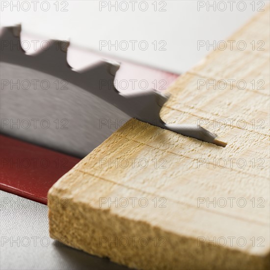 Close up of saw cutting wood.