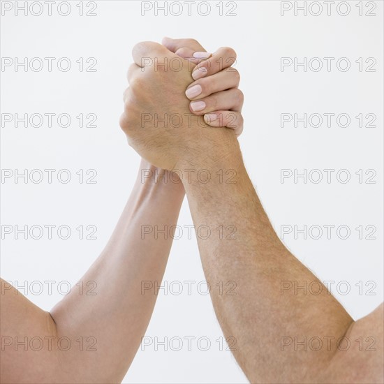 Couple arm wrestling.