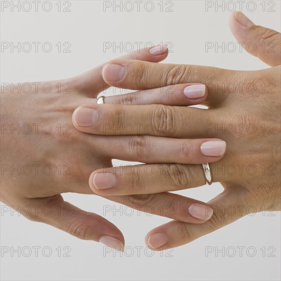 Wedding rings on couple’s hands.