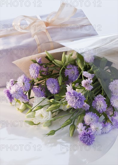 Bouquet of flowers and gift.