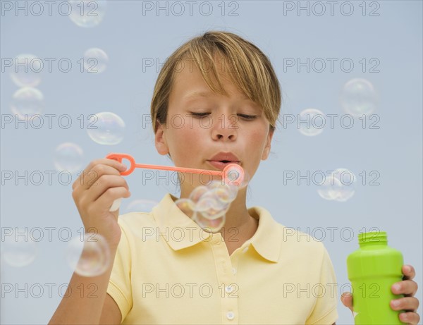 Girl blowing bubbles.