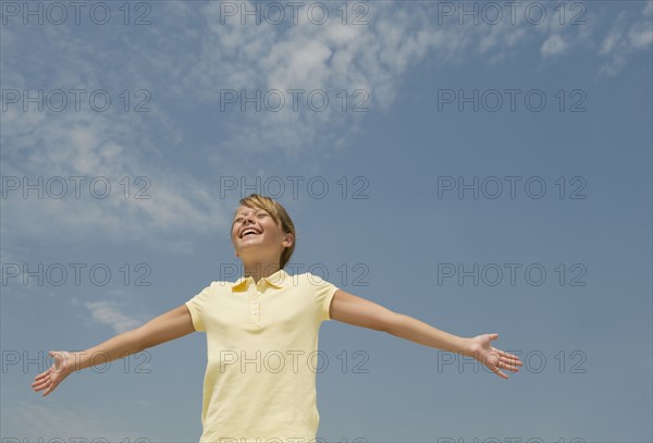 Girl with arms outstretched.