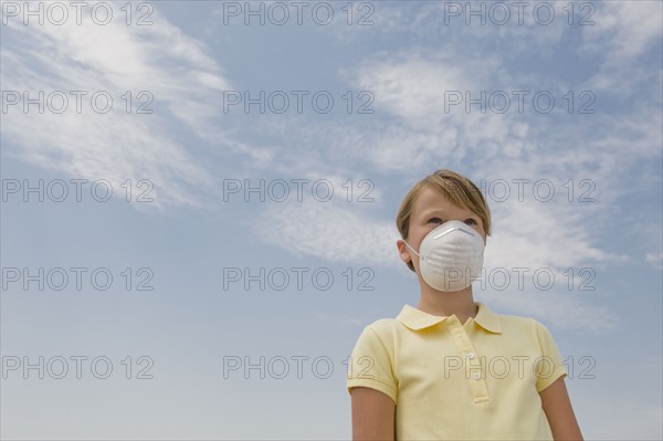 Girl wearing dust mask.