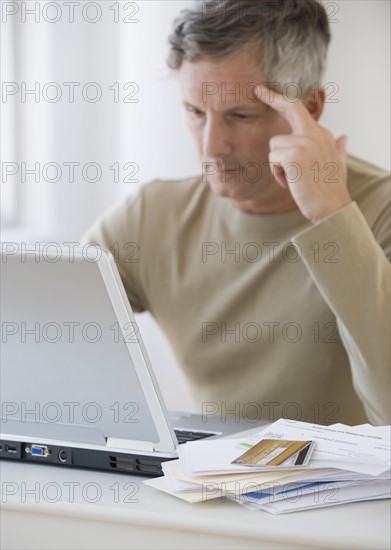 Man paying bills online.