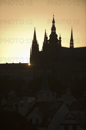 Sunset over silhouetted cathedral.