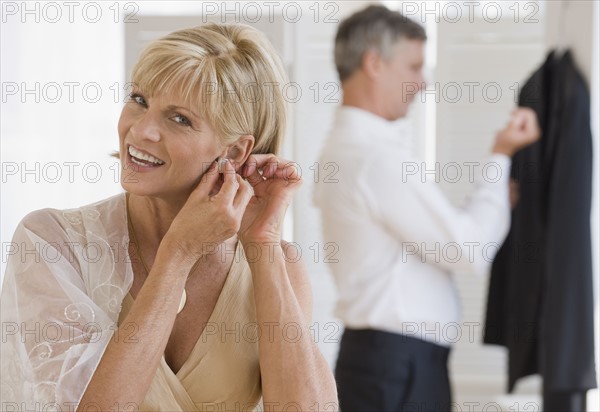 Couple getting dressed.