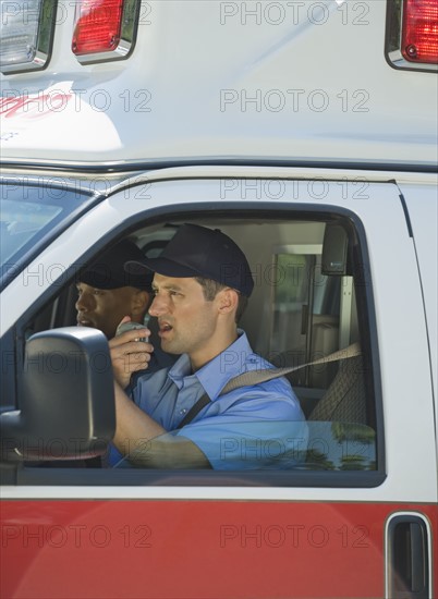 EMT’s driving in ambulance.