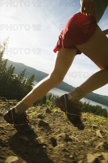 Runner on rocky trail. Date : 2008