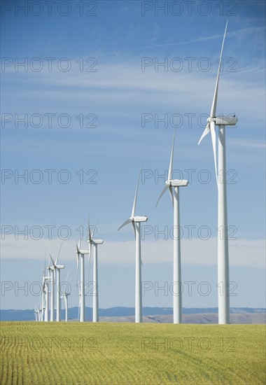 Windmills in a row on wind farm. Date : 2008