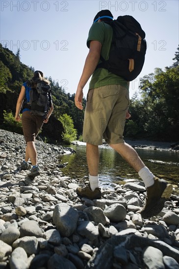 Hikers walking along river. Date : 2008