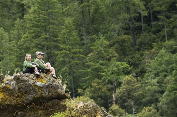 Hikers enjoying view from rock outcropping. Date : 2008