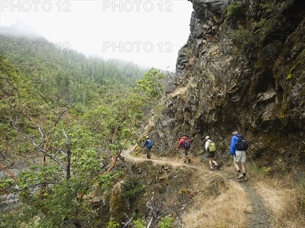 Group of hikers hiking on trail. Date : 2008