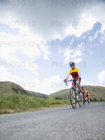 Cyclists in a row on country road. Date : 2008