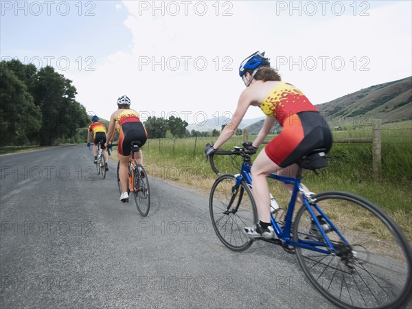 Cyclists in a row on country road. Date : 2008