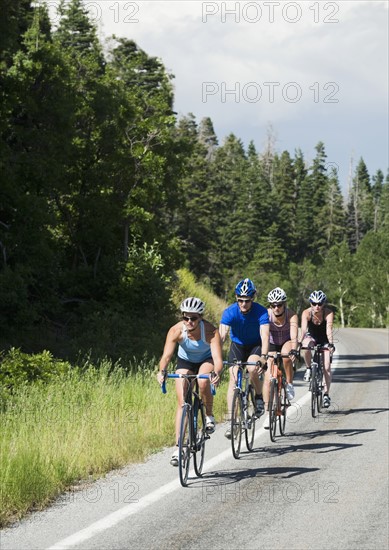 Cyclists in a row on mountain road. Date : 2008