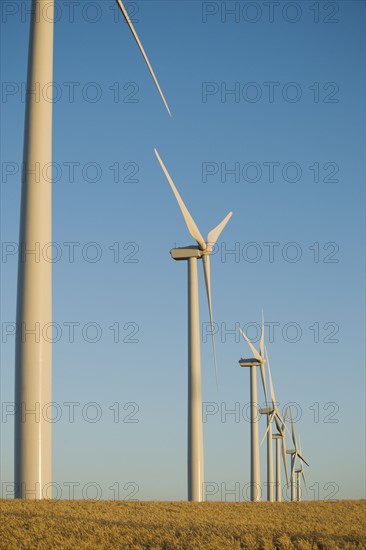 Row of windmills on wind farm. Date : 2008