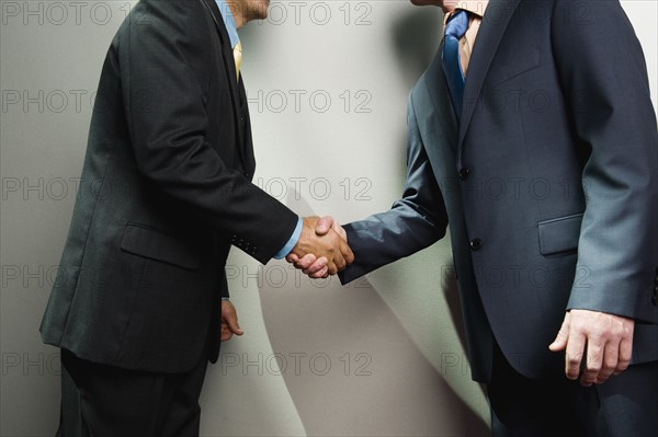 Businessmen shaking hands. Date : 2008