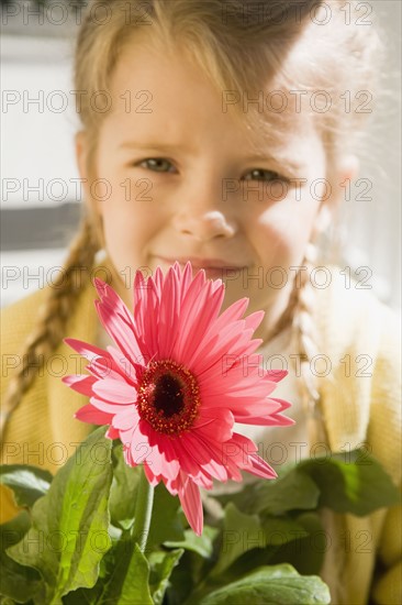 Girl holding flower. Date : 2008