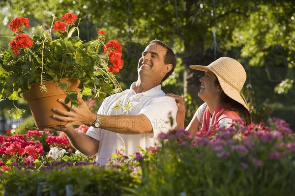 Couple shopping for flowers. Date : 2008