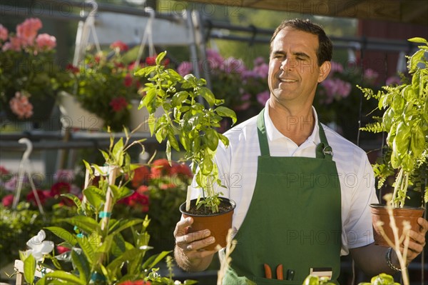 Man working in garden center. Date : 2008