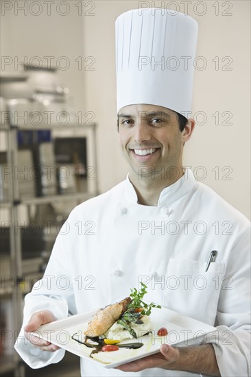 Chef presenting gourmet entree. Date : 2008