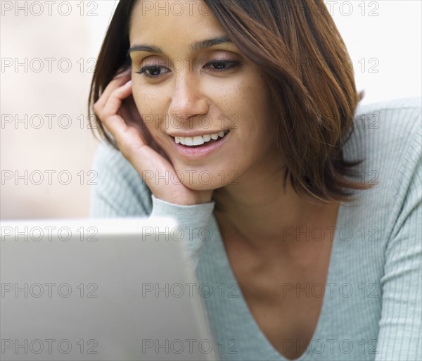 Woman looking at laptop. Date : 2008