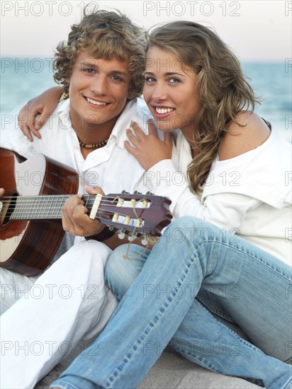 Young couple relaxing on beach. Date : 2008