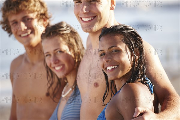Young couples posing on beach. Date : 2008