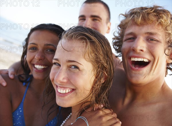 Young couples laughing on beach. Date : 2008