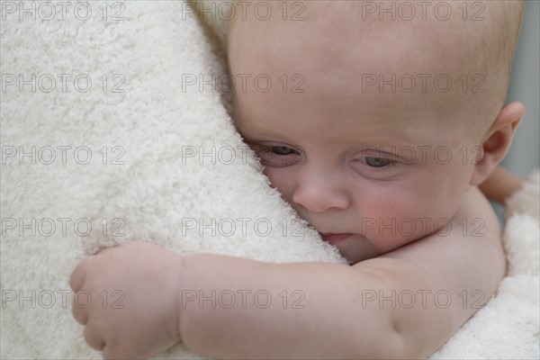 Mother hugging baby boy. Date : 2008