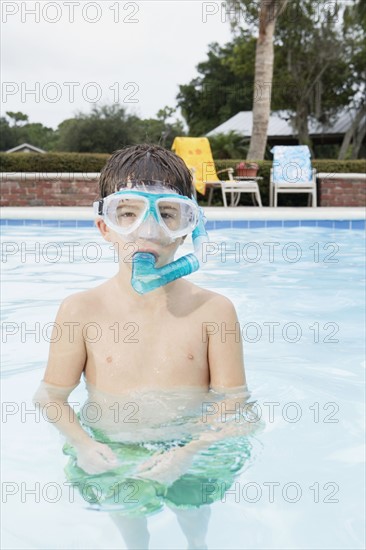 Boy snorkeling in swimming pool. Date : 2008