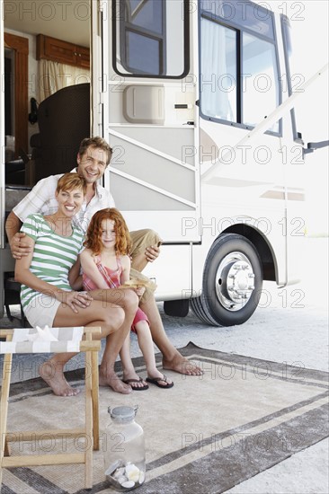 Family sitting on motor home steps. Date : 2008