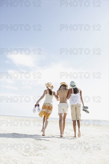 Friends walking in beach. Date : 2008