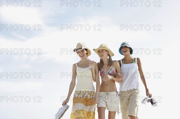 Friends walking in beach. Date : 2008