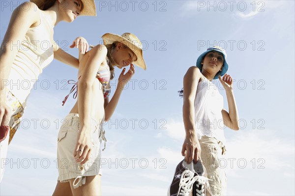 Friends walking in beach. Date : 2008