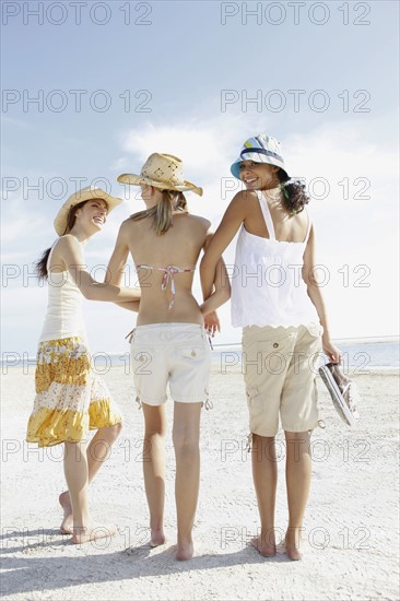 Friends walking in beach. Date : 2008