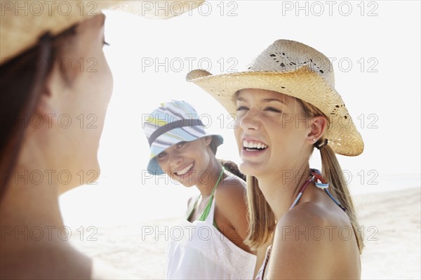 Friends laughing in beach. Date : 2008