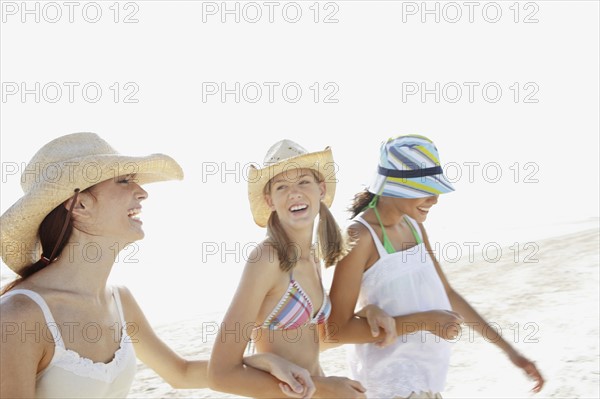 Friends walking on beach. Date : 2008