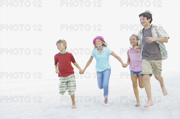 Children running on beach. Date : 2008