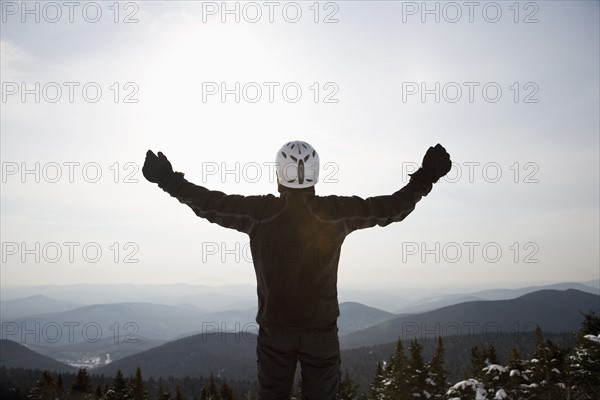 Snowboarder at top of ski hill. Date : 2008