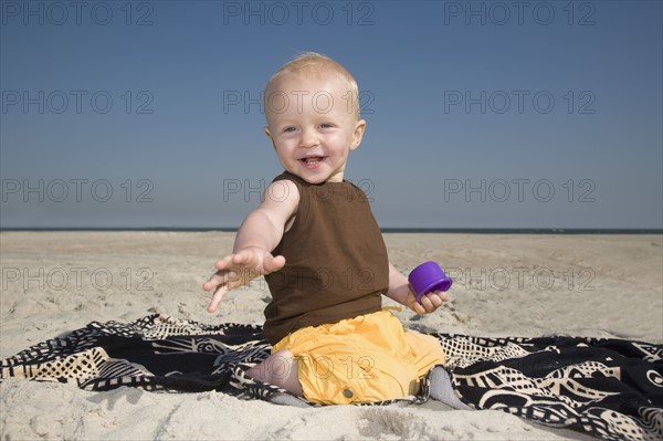 Baby boy playing at beach. Date : 2008