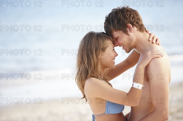 Young couple hugging on beach. Date : 2008