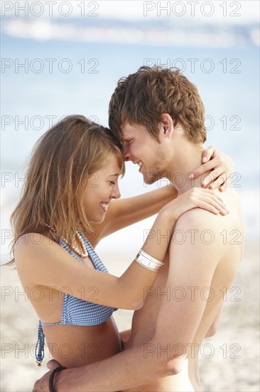 Young couple hugging on beach. Date : 2008